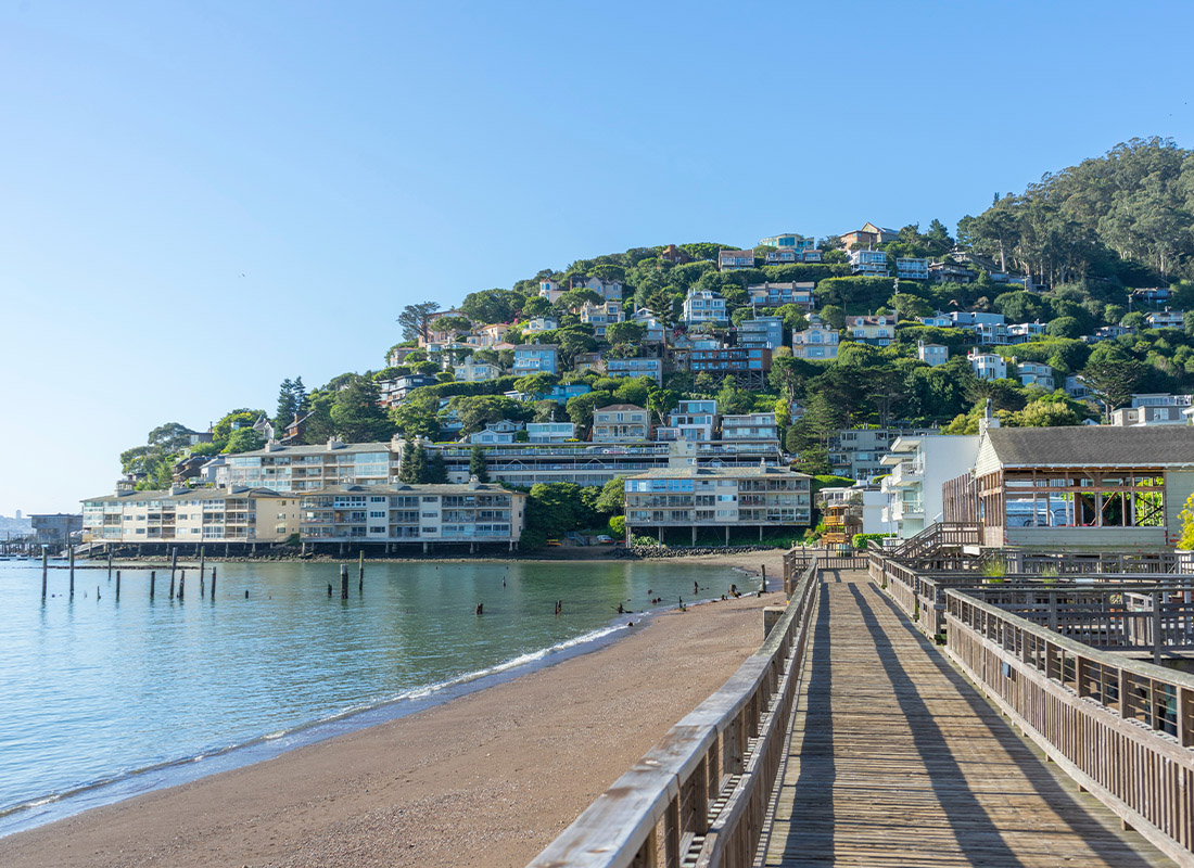 Los Alamito, CA - View of Pier and Walkway Along the Beach With Homes and Communities Along the Coast on a Sunny Day